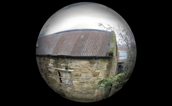 Fish eye camera photograph of farm building made of bricks 